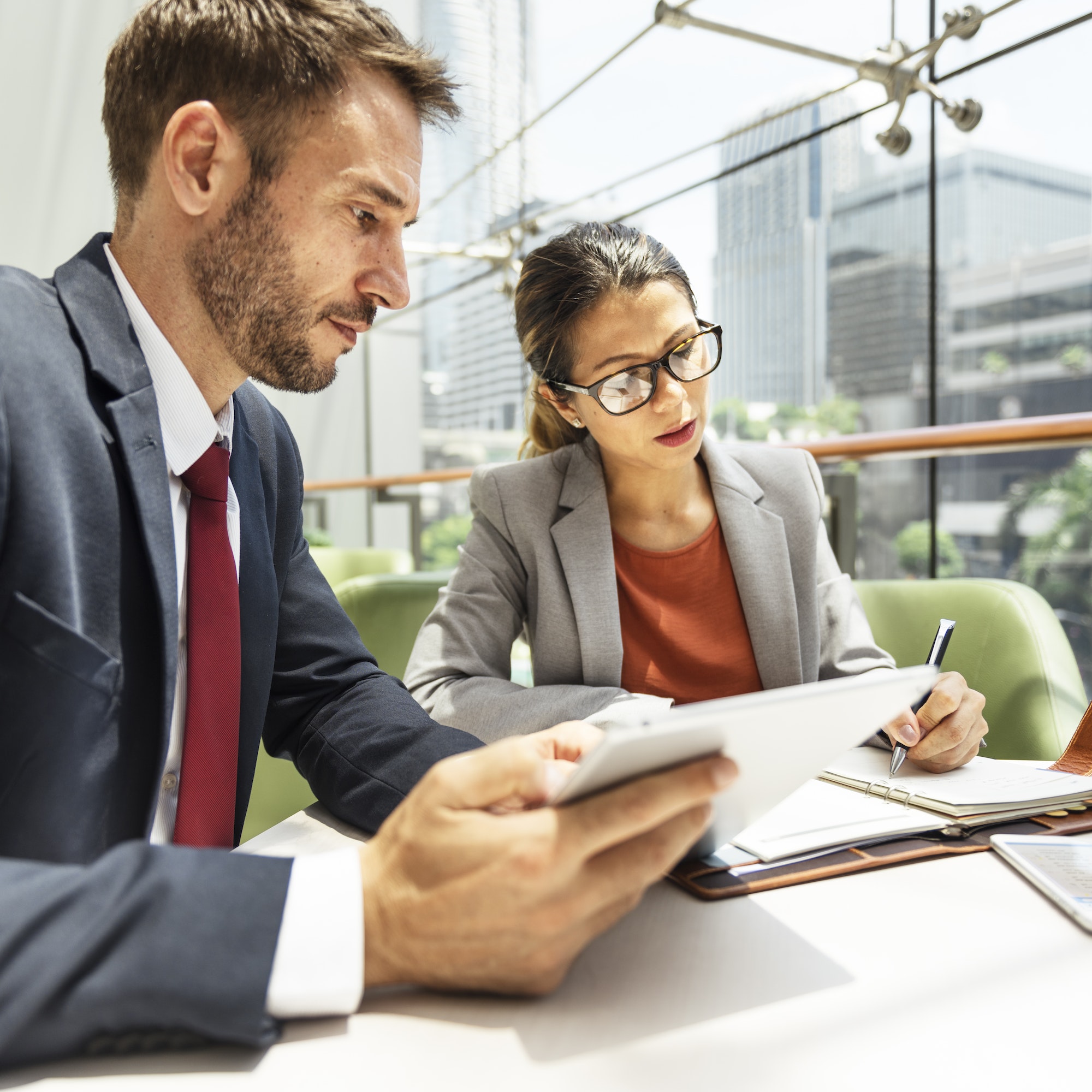 business people discussion digital tablet technology togethernes.jpg